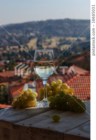 glass wine on a background of mountains glass wine on a background of mountains 16685031