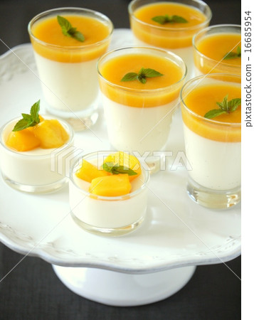 Mango panna cotta dessert stand version Black background (vertical position) Mango panna cotta dessert stand version Black background (vertical position) 16685954