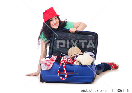 Young girl packing for vacation Young girl packing for vacation 16686136