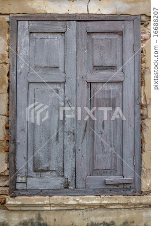 closed rotten wooden window in Bangkok closed rotten wooden window in Bangkok 16688207