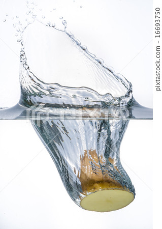cut potato plunging into water cut potato plunging into water 16693750