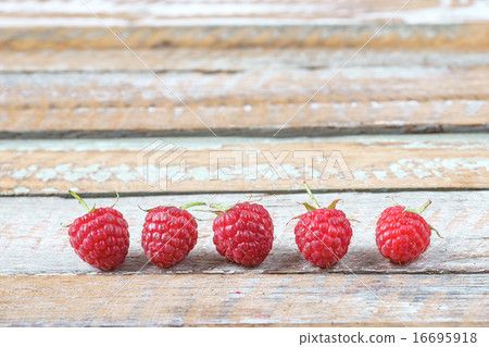 Red raspberry arrange on old vintage wooden table. Red raspberry arrange on old vintage wooden table. 16695918