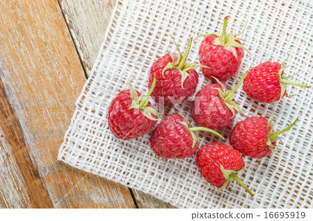 Red raspberry on old vintage wooden tabl Red raspberry on old vintage wooden tabl 16695919
