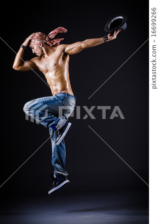 Dancer dancing in the dark studio 16699266
