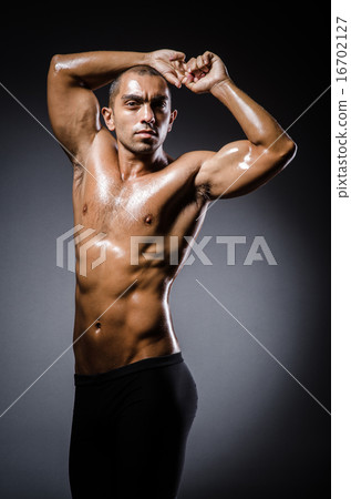 Ripped young man in bodybuilding concept 16702127