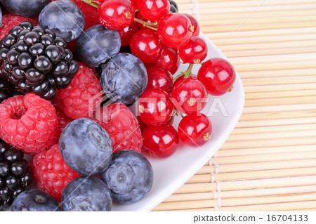 Assortment of berries on plate 16704133