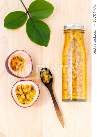 Fresh passion fruit and juice in the bottle. Fresh passion fruit and juice in the bottle. 16704470