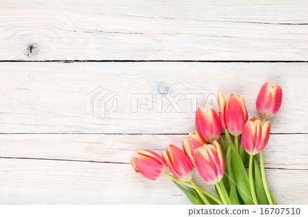 Colorful tulips on wooden table 16707510
