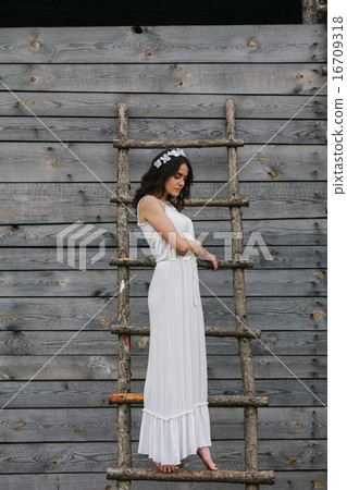 Girl climbing ladder into tree house Girl climbing ladder into tree house 16709318