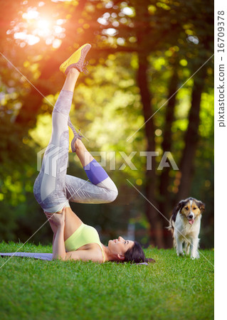 Woman doing fitness exercises in the park 16709378