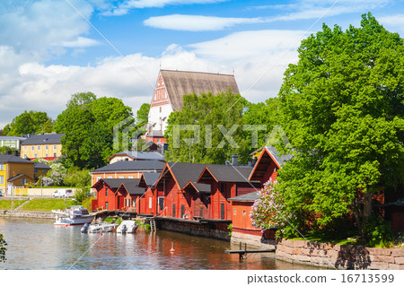 Finland. Old red wooden houses and trees 16713599