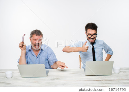 The two colleagues working together at office on white background 16714793