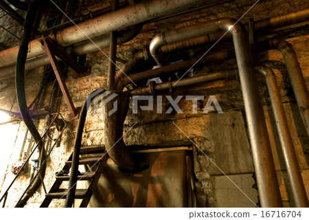 Old abandoned dirty empty scary factory interior 16716704