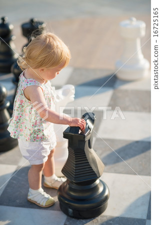 Baby girl playing with chess Baby girl playing with chess 16725165