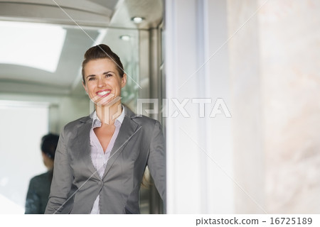Portrait of business woman in elevator 16725189