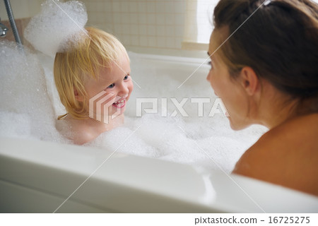 Mother and baby taking bath and playing with foam Mother and baby taking bath and playing with foam 16725275