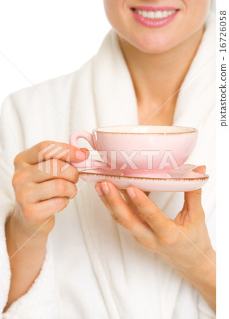 Closeup on woman in bathrobe with cup of coffee 16726058