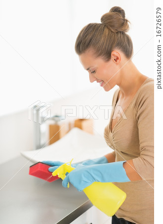 Housewife cleaning in bathroom Housewife cleaning in bathroom 16726579