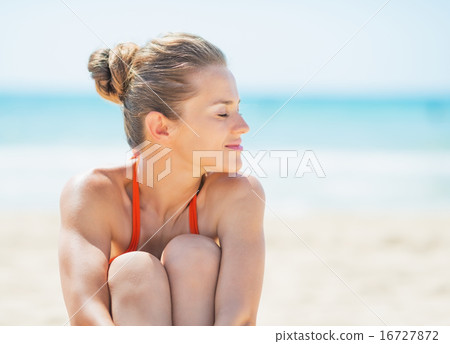 Young woman relaxing on beach Young woman relaxing on beach 16727872
