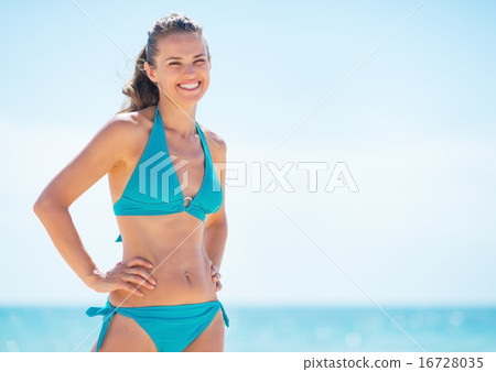 Portrait of happy young woman on beach Portrait of happy young woman on beach 16728035