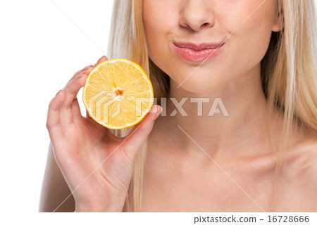 Closeup on teenager showing lemon Closeup on teenager showing lemon 16728666