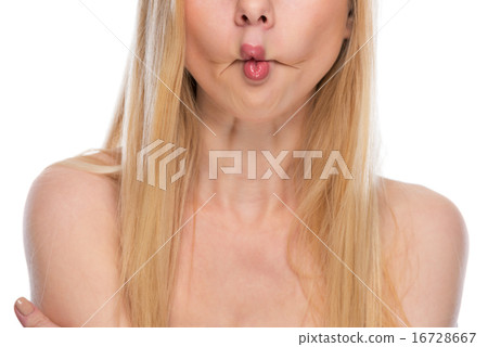 Closeup on teenager making fish face Closeup on teenager making fish face 16728667