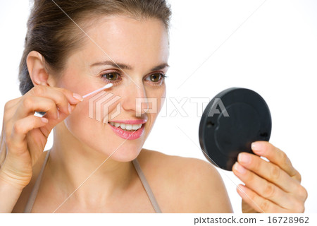 Beauty portrait of happy young woman using cotton swabs 16728962