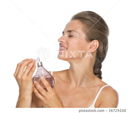 Young woman applying perfume Young woman applying perfume 16729108