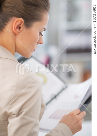 Business woman working with documents Business woman working with documents 16729903