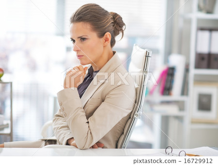 Portrait of thoughtful business woman at work 16729912