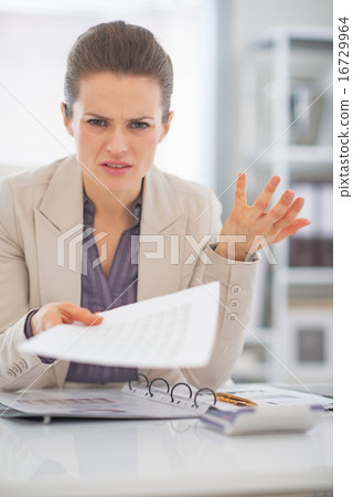 Portrait of frustrated business woman at work Portrait of frustrated business woman at work 16729964