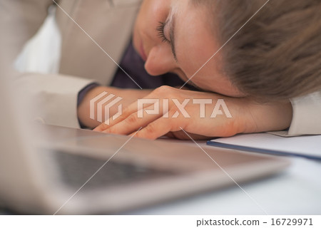 Closeup on tired business woman in office 16729971