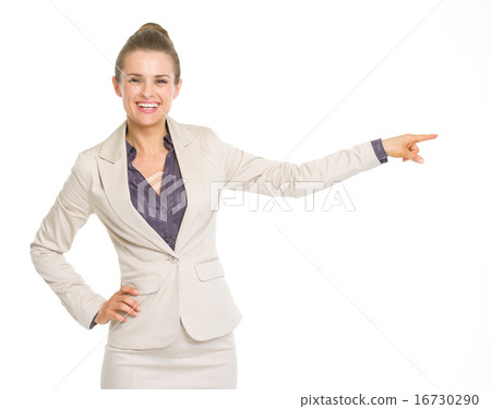 Happy business woman pointing on copy space Happy business woman pointing on copy space 16730290