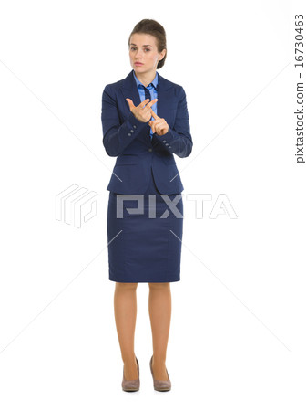 Full length portrait of business woman counting on fingers Full length portrait of business woman counting on fingers 16730463