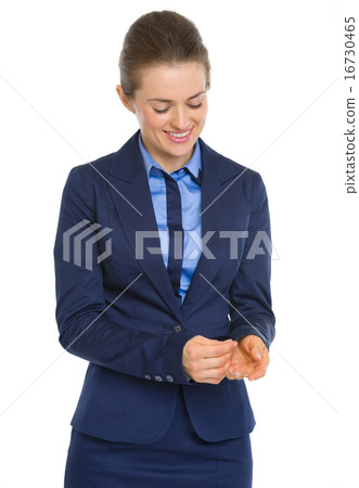 Happy business woman adjusting cuff Happy business woman adjusting cuff 16730465