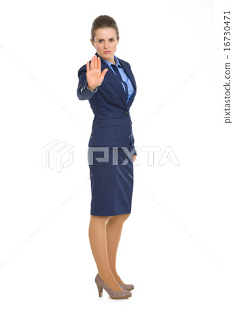 Full length portrait of business woman showing stop gesture Full length portrait of business woman showing stop gesture 16730471