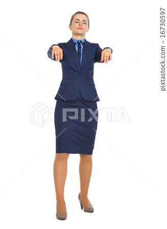 Full length portrait of business woman walking like zombie Full length portrait of business woman walking like zombie 16730597
