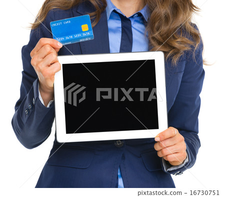 Closeup on business woman holding tablet pc blank screen and cre Closeup on business woman holding tablet pc blank screen and cre 16730751