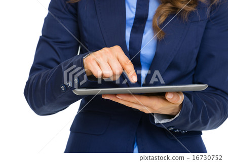 Closeup on business woman working on tablet pc Closeup on business woman working on tablet pc 16730752