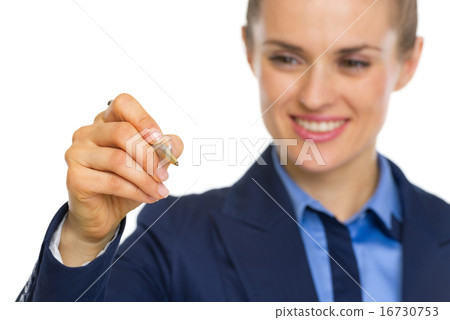 Closeup on business woman writing in air with pen 16730753