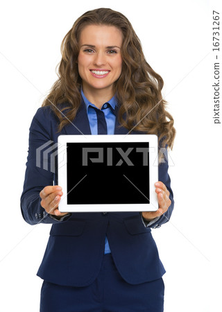 Smiling business woman showing tablet pc blank screen 16731267