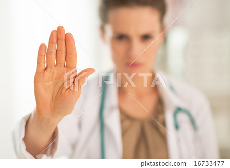 Closeup on serious medical doctor woman showing stop gesture Closeup on serious medical doctor woman showing stop gesture 16733477