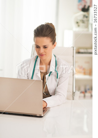 Doctor woman working on laptop Doctor woman working on laptop 16733527