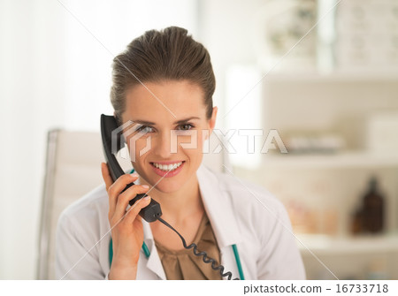 Portrait of doctor woman talking phone Portrait of doctor woman talking phone 16733718
