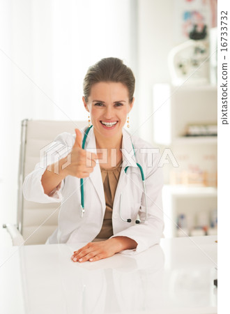 Portrait of happy doctor woman showing thumbs up Portrait of happy doctor woman showing thumbs up 16733732
