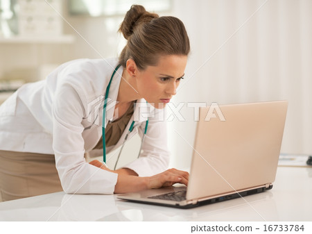 Doctor woman using laptop in office Doctor woman using laptop in office 16733784