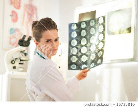Portrait of medical doctor woman with tomography 16733810
