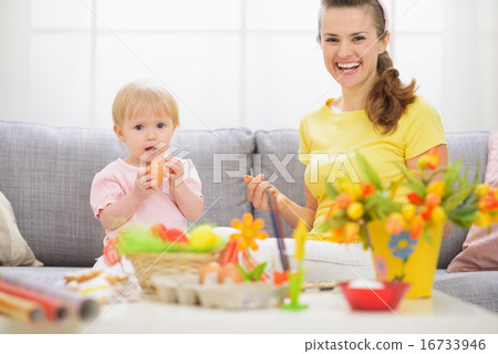 Baby and mother having fun on Easter Baby and mother having fun on Easter 16733946
