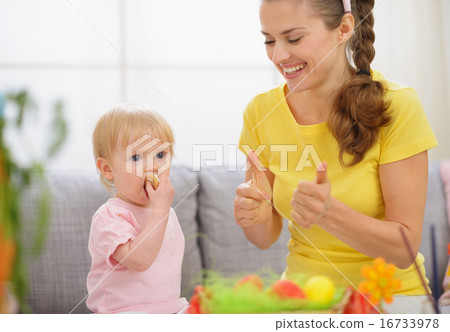 Baby and mother spending time together on Easter Baby and mother spending time together on Easter 16733978