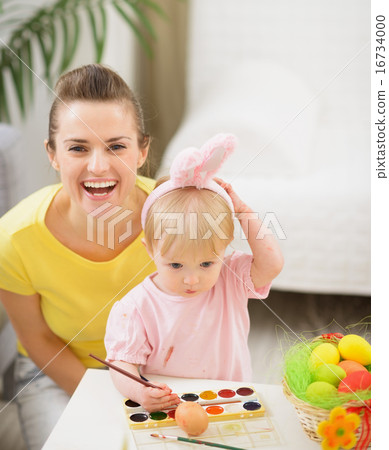 Baby and mother having fun on Easter Baby and mother having fun on Easter 16734000
